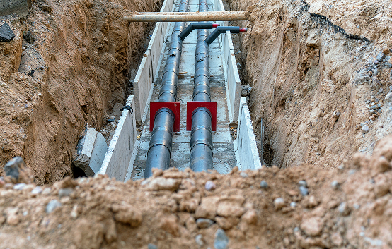 Underground pipes in a construction trench.